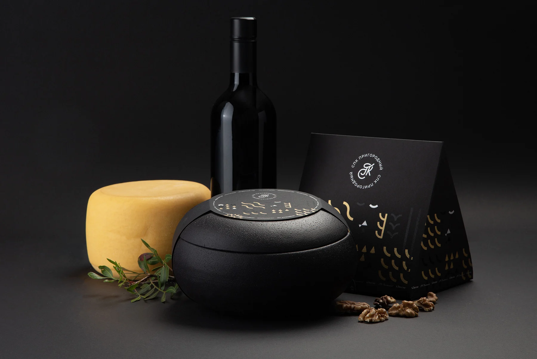 Black ceramic case and cardboard cheese packaging