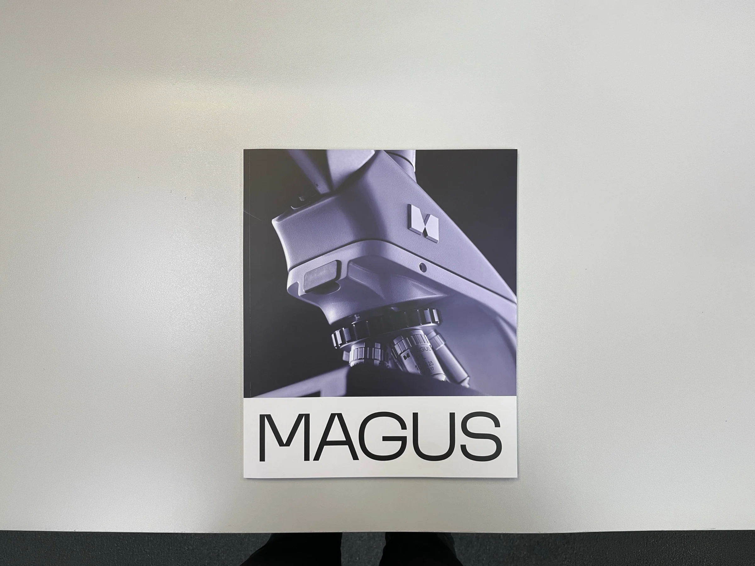 MAGUS brochure on a light table