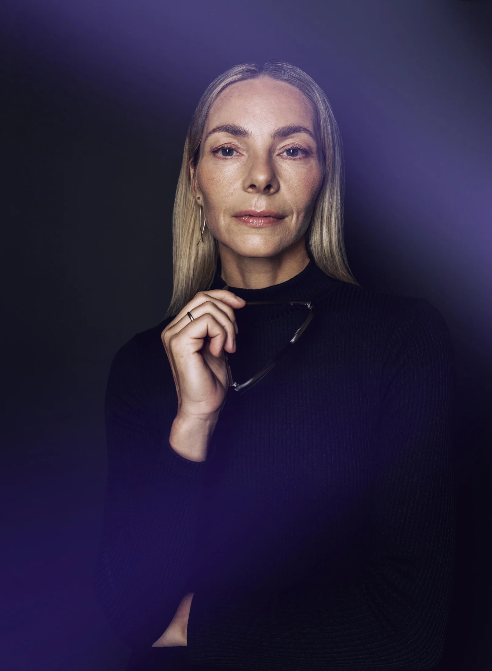 Editorial portrait of a MAGUS employee in dark clothing
