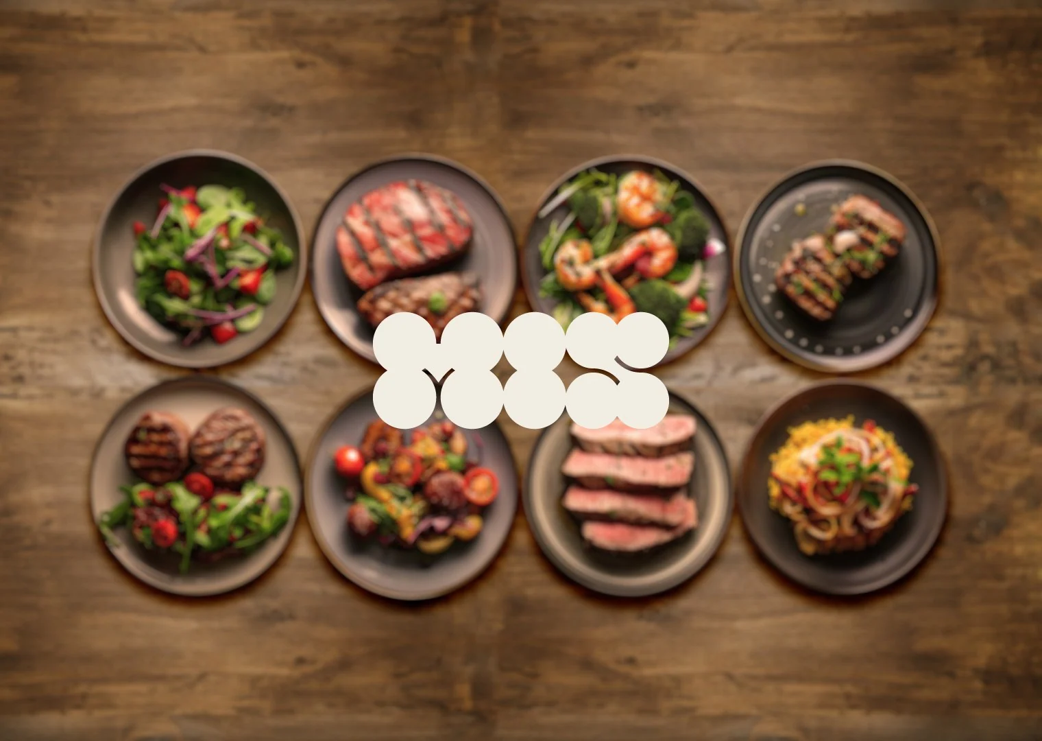 MIS logo above a shared table of dishes