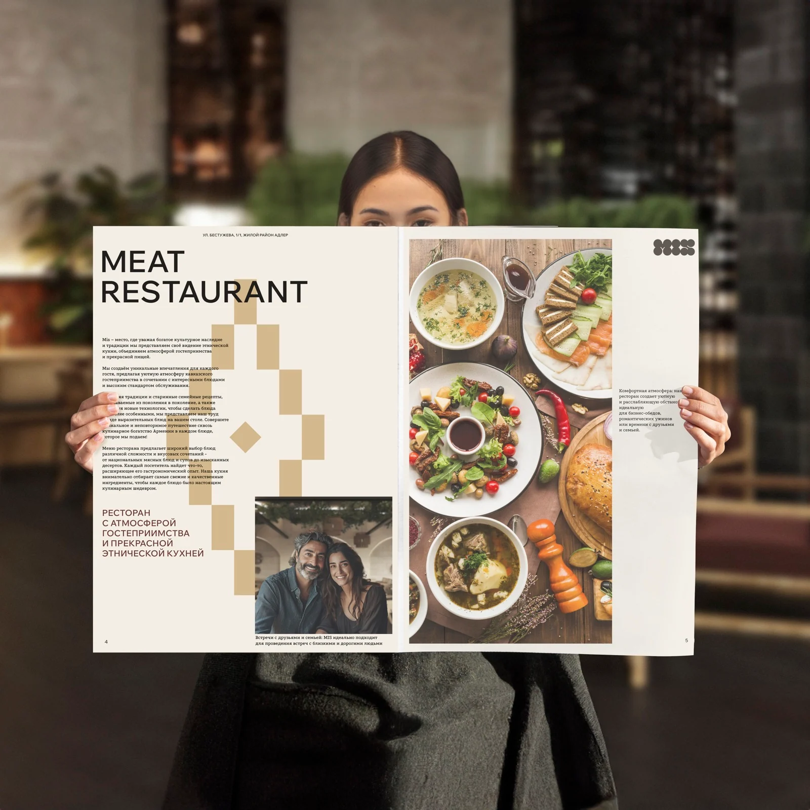 Open newspaper-format MIS menu in a restaurant guest's hands