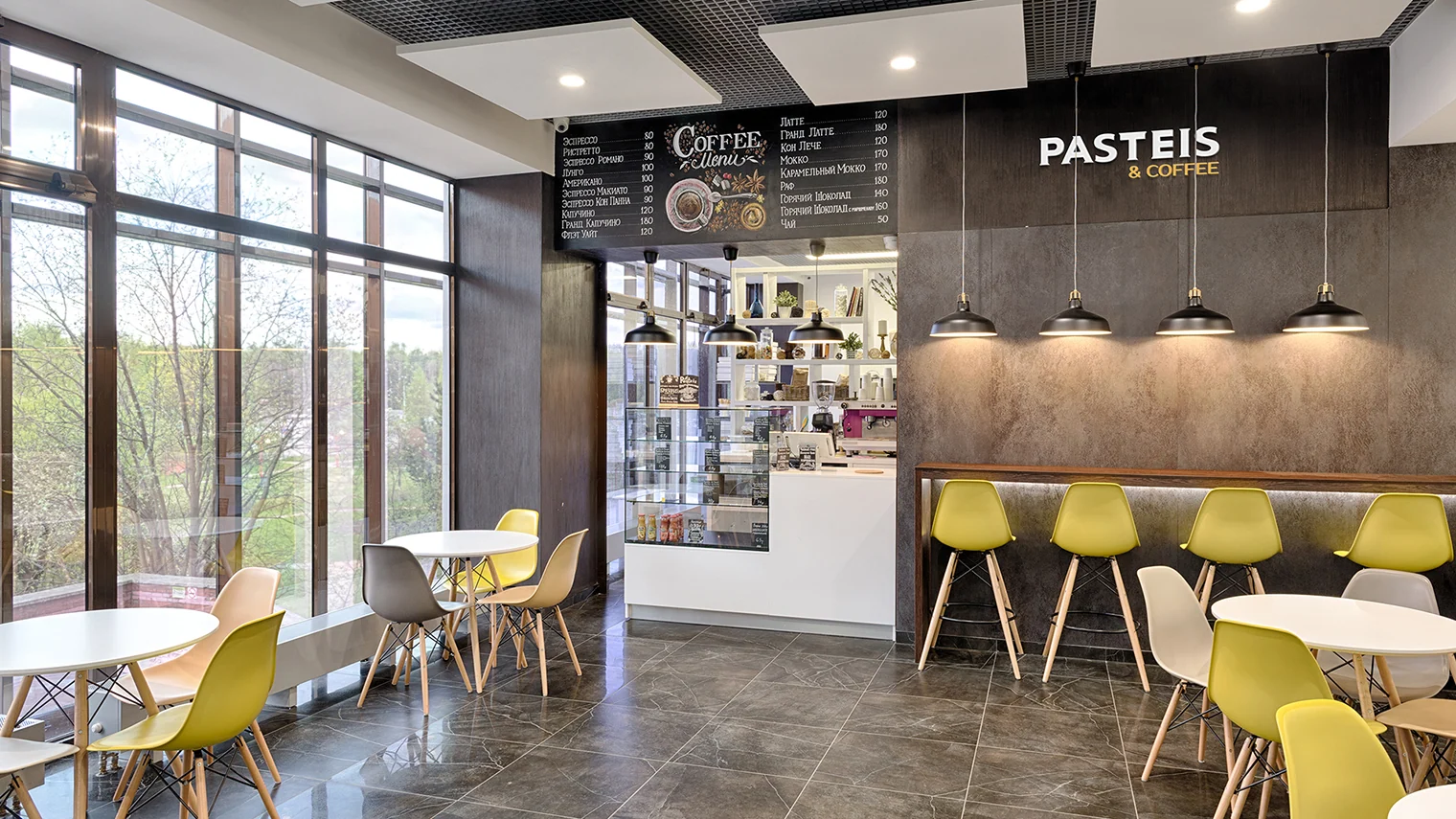 Pasteis & Coffee café interior with the brand pattern