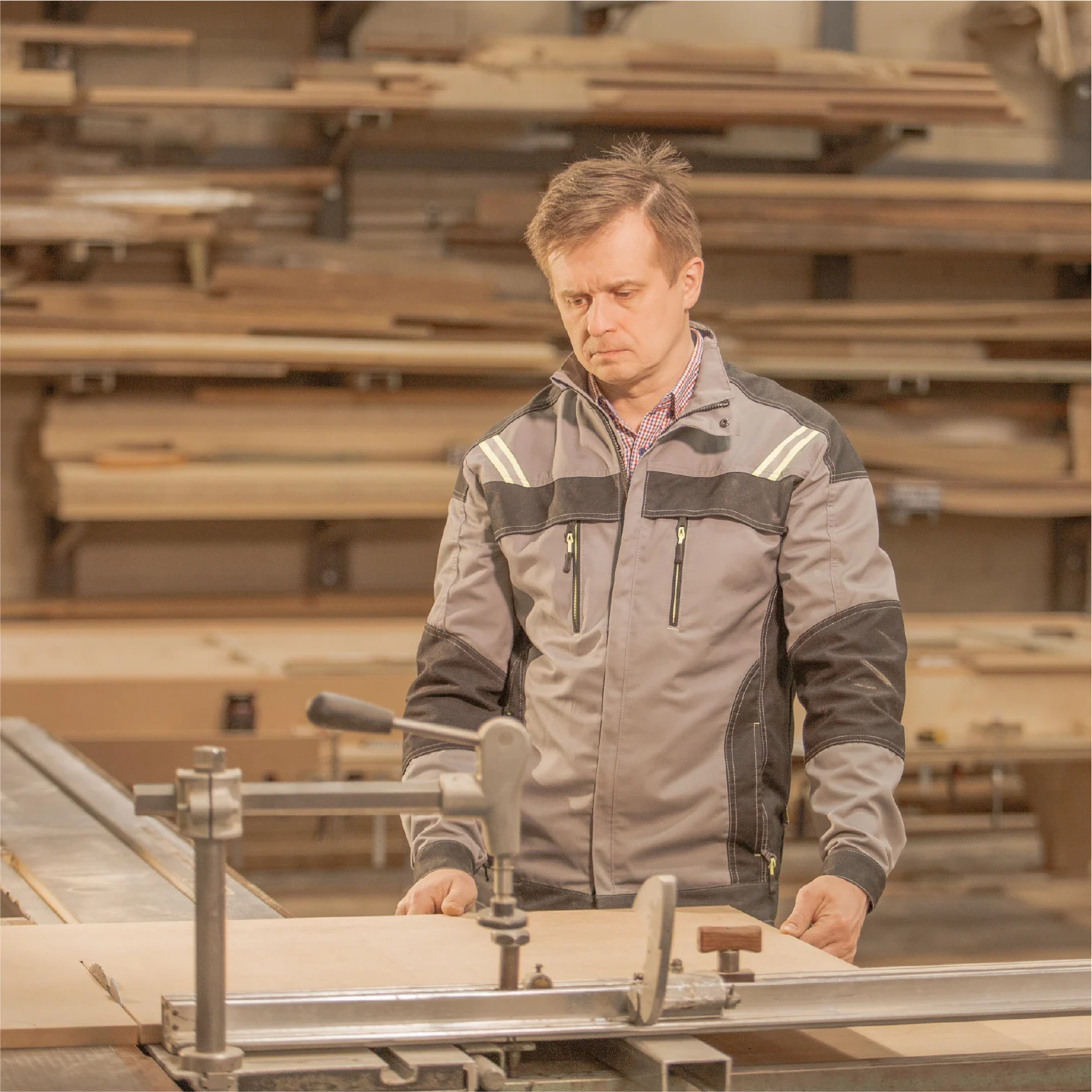 Craftsperson working at a woodworking machine in the STEK workshop
